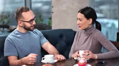 Cheerful Couple Having Romantic Meeting Coffee Break Talking in Cafe