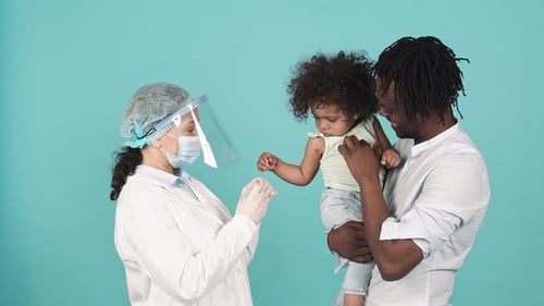 Doctor Administering a Shot to a Young Child