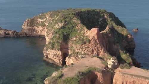 Aerial view of rocks on the ocean shore