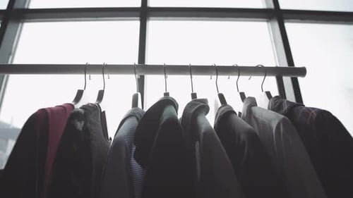 On Floor Stand for Clothes Hanging Wooden Hangers with Things
