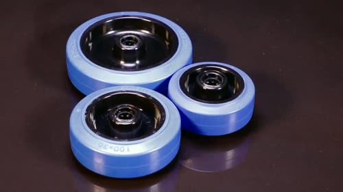 Blue Industrial Wheels on Dark Background