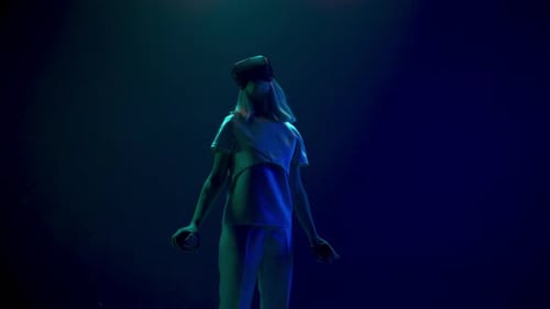 Young Adult Using VR Headset and Controllers