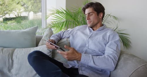 Caucasian man using a digital tablet
