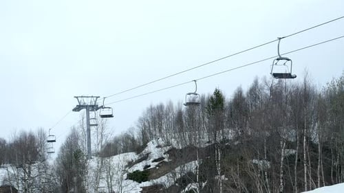 Empty Funicular Cabins Go on the Ropeway Through Fog. Timelapse Footage. Early Morning Trip Above