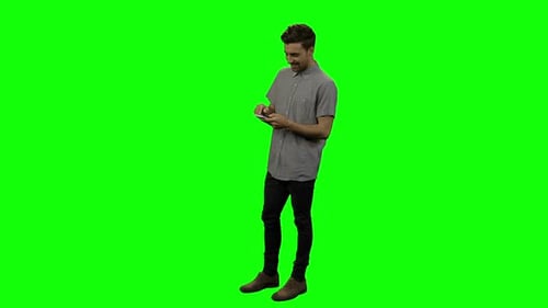 Happy man using mobile phone