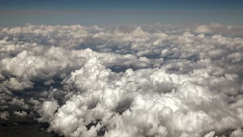 Airplane View of Partly Cloudy and Cumulus Clouds Condensed in Clusters in Humid Warm Air