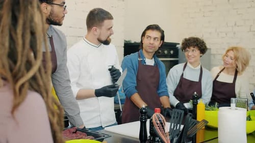 Chef Demonstrates Knife Sharpening in a Cooking Class