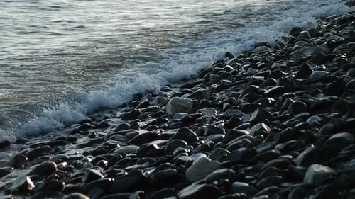 Waves Washing Over a Rocky Beach Coastline