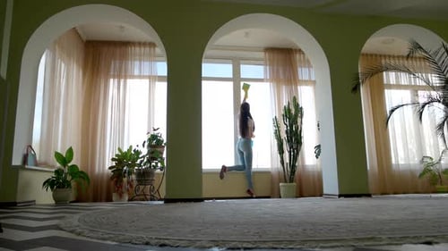 Girl Washing Window with Detergent