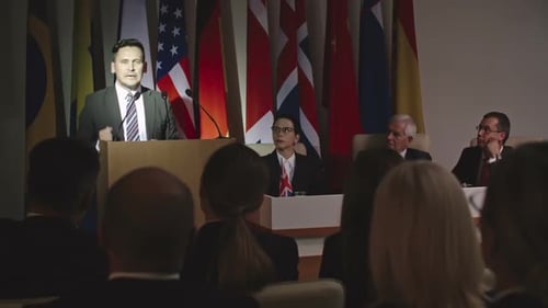 Man Giving Speech at International Conference