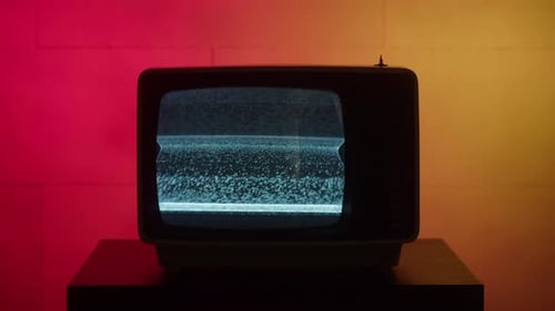 Old Retro Square Television on Red and Yellow Neon Background Screen with Ripples and Interference