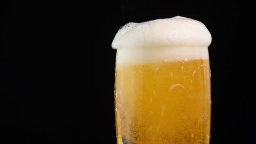 Pouring Cold Beer into a Mug, Close Up