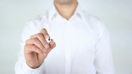 Man Writes the Word Favorite on Clear Surface