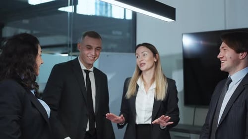 Happy Business People Putting Hands Together