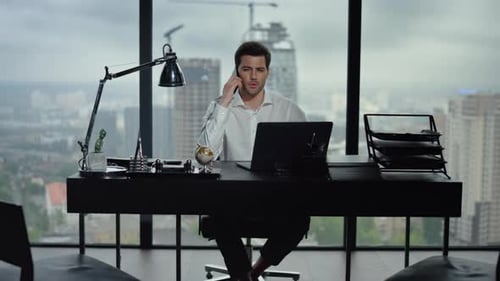Man Talking on Phone at Modern City Office