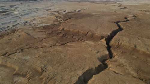 Desert brown stone huge crack in the ground, drone shot