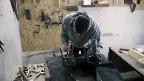 Tinsmith Blacksmith Use Hammer Working in His Workshop
