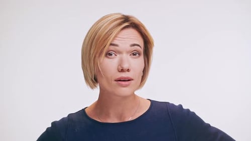 Caucasian Middleaged Female with Blonde Hair Standing on White Background Trying to Hear in