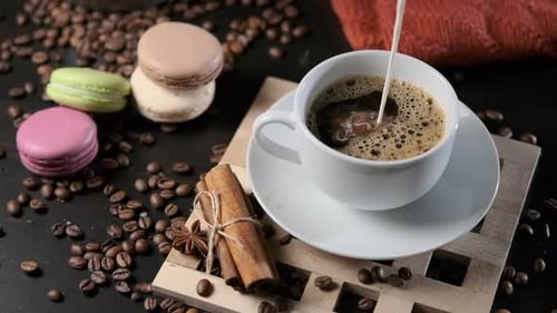 Close Up of Pouring Milk Cream Into Cup of Coffee
