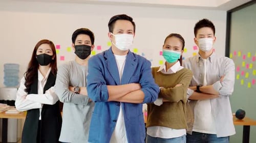 Young Adults Wearing Face Masks in an Office