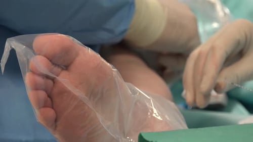 Medical Procedure on Foot in Hospital Setting