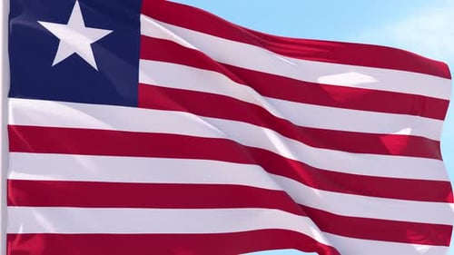 Realistic Liberia Flag Waving Against Clear Sky