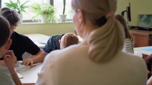 Video of school children and teacher in classroom. Shot with RED helium camera in 8K.