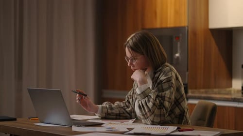 Pretty Student Woman Sit at Home Looking at Computer Screen Makes Assignment Elearning on Laptop