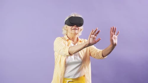 Senior Woman Experiencing Virtual Reality Headset Technology