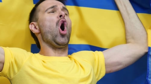 Man Cheering with Flag