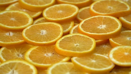 Rotate Fresh Citrus Oranges Fruits. Seamless Loop Spinning Sliced Oranges.