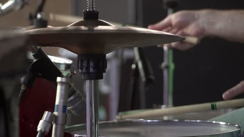 Drummer Plays the Drum Set at the Concert of Plates for Rhythm Rock Concert