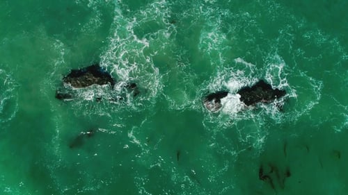Oceanic Waves Are Broken Up Into Rocks. View From the Top. Malibu, California