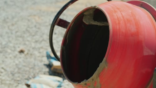Rotating Cement Mixer Blends Materials on Construction Site