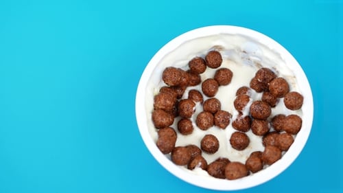 Jar of Yogurt with Spoon and Chocolate Balls