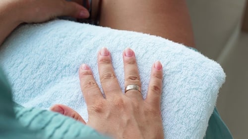 Home Manicure and Care Concept. Process Applying Decorative Nail Lacquer While Home Manicure. Woman