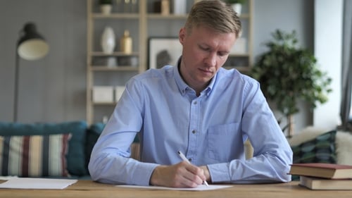 Pensive Businessman Writing While Sitting in Office, Writer