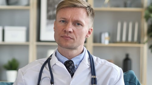 Stern Doctor Shakes Finger as a Warning