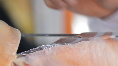 Cutting Serrano Ham Food with a Ham Knife