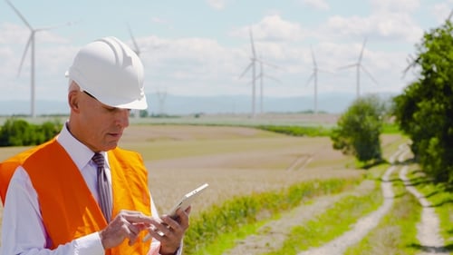 Engineer Using Digital Tablet at Windmills Farm