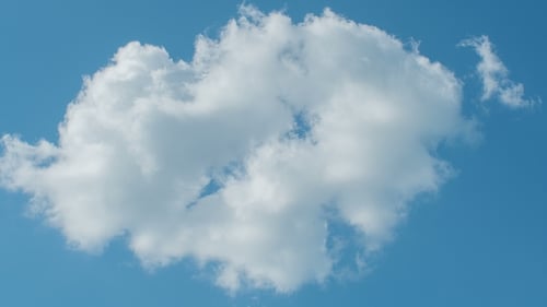 White Clouds Flying on Blue Sky