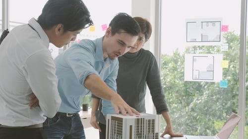Team of Creative Architects Working Together in a Architect Studio.