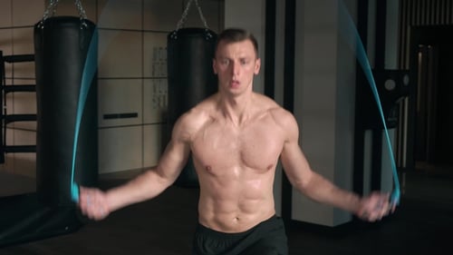 Athletic Man Skipping with a Jump Rope