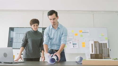 Team of Creative Architects Working Together in a Architect Studio.