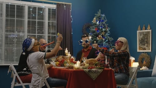 Family Celebrates Christmas with Party Poppers and Cheer