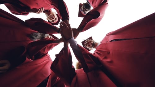 Graduation Students Join Hands in Celebration