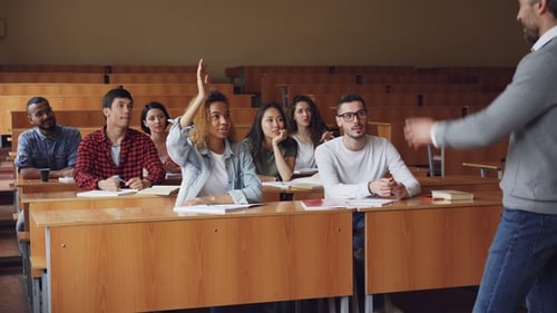Diverse Students Attending a College Lecture