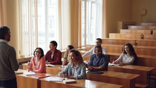 Young People College Students Are Laughing and Talking To Friendly Professor Who Is Standing in