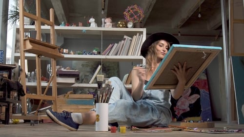 Female Artist Painting in Sunny Art Studio