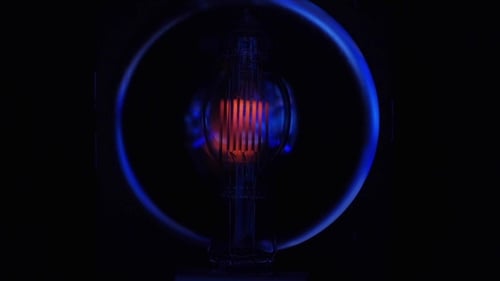 Glowing Light Bulb Illuminating Technology and Innovation